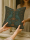Square woven tapestry pillow featuring two symmetrical embroidered peacocks with a crescent moon and floral detailing on a dark background. The pillow measures 17x18 inches and is crafted from a cotton-polyester blend with plush poly fill. Both sides display the same ornate design. Decorative and gothic in style, suitable for cottagecore, whimsigoth, and folklore-inspired home decor settings.